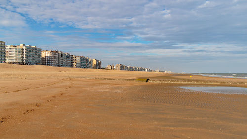 View of beach against cloudy sky