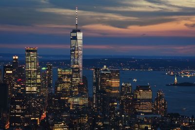 Illuminated buildings against sky at night nyc 