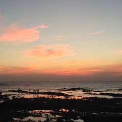 Scenic view of sea at sunset