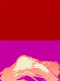 Low angle view of red wall