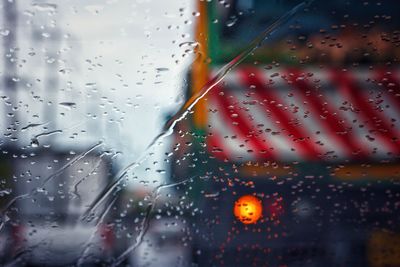 Full frame shot of wet glass window in rainy season