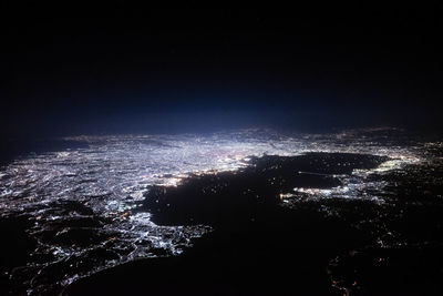 High angle view of illuminated cityscape at night