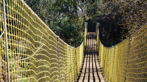 Close-up of chainlink fence. bridge in the aguas de ramón natural park, santiago, chile