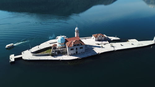 High angle view of buildings by sea