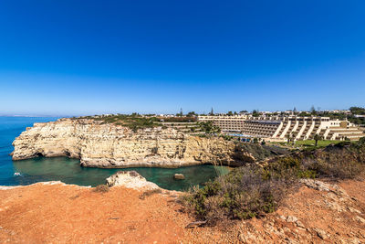 Scenic view of sea against clear blue sky