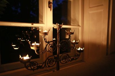 Close-up of illuminated lamp at home