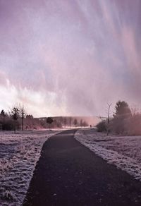 Scenic view of beach against sky during winter