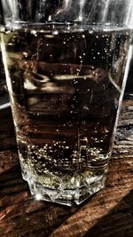 Close-up of wine in glass on table