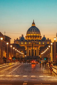 Illuminated vatican against clear sky at dusk