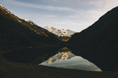 Scenic view of snowcapped mountains against sky