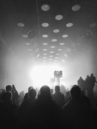 Silhouette of people at music concert