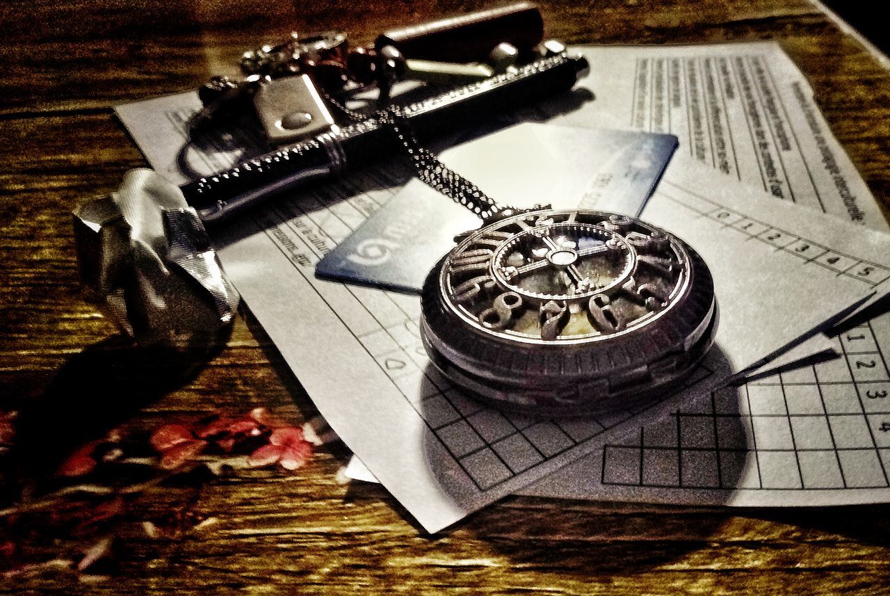 CLOSE-UP OF CLOCK ON TABLE AT HOME