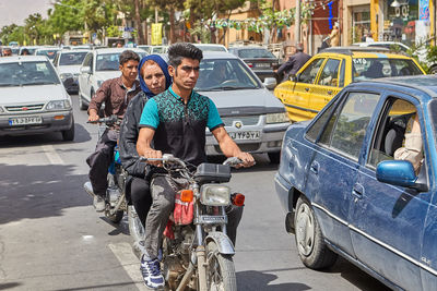 Portrait of friends on street in city