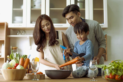 Women standing by food on table