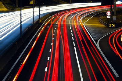 High angle view of light trails on road