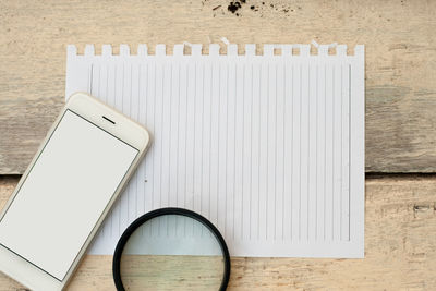 High angle view of smart phone on table