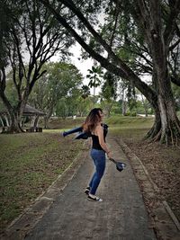 Full length of woman on road