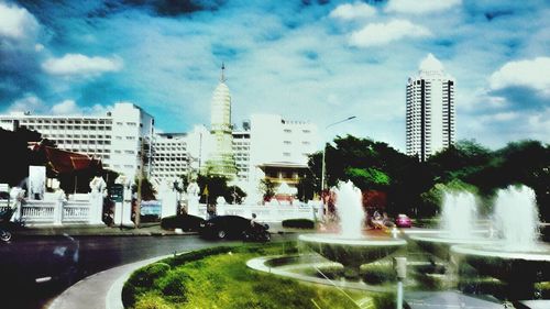 City skyline against cloudy sky