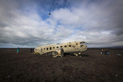 View of abandoned airplane on beach