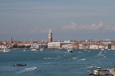 Basin of san marco full of venetian water traffic in front of venice's iconic skyline