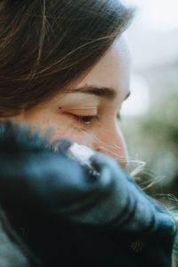 Close-up of thoughtful woman during winter