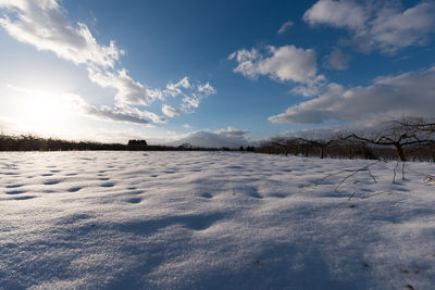 Scenic view of landscape against sky during winter