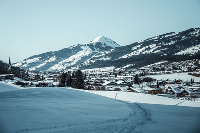 Scenic view of snowcapped mountains against clear sky