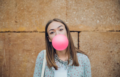 Portrait of a beautiful young woman with bubbles