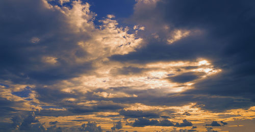 Low angle view of clouds in sky during sunset