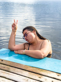 Portrait of young woman in swimming pool