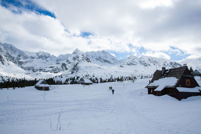 Snow covered mountains against sky