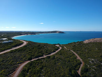 Scenic view of sea against clear blue sky