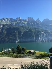 Scenic view of lake against blue sky