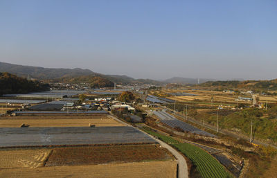 High angle view of field against clear sky