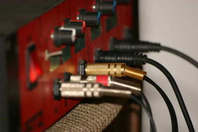 Close-up of cables connected to amplifier