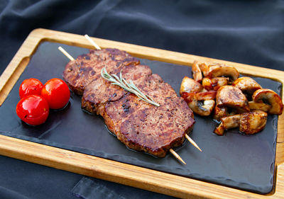 High angle view of meat on barbecue grill