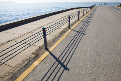 High angle view of railing by sea