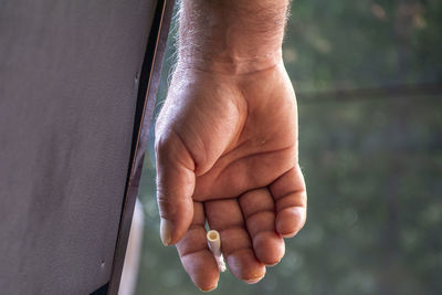 Close-up of person holding hands