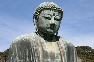 Low angle view of statue against the sky