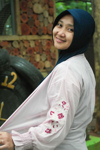 Portrait of smiling young woman in traditional clothing