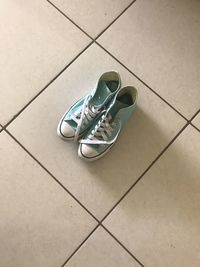 High angle view of shoes on tiled floor