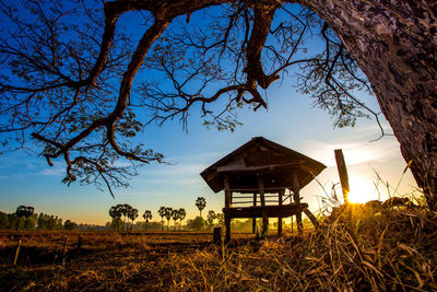 Gazebo on field against sky