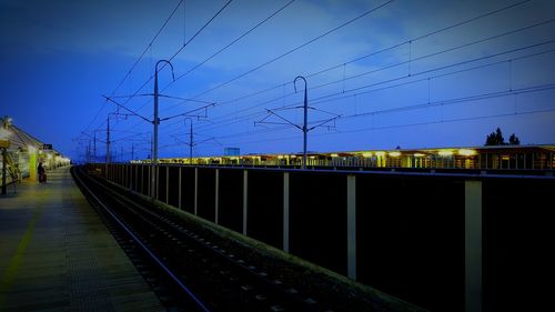 Railroad tracks against blue sky