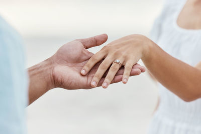 Midsection of woman holding hands