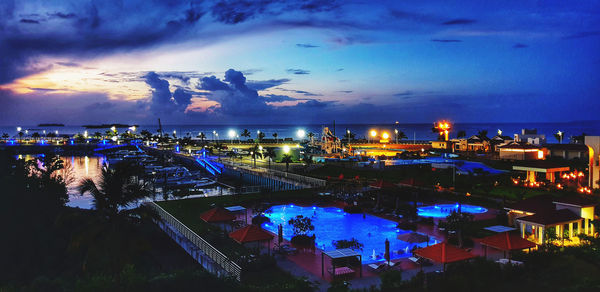 High angle view of illuminated buildings in city at night