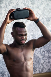 Portrait of young man using mobile phone