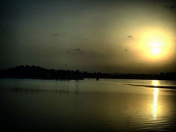 Scenic view of lake at sunset