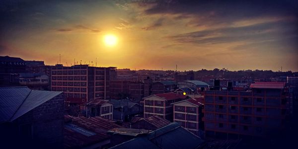 Cityscape against sky during sunset