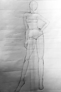 Digital composite image of hand on wall