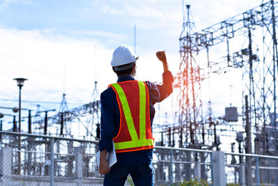 Rear view of man working at construction site